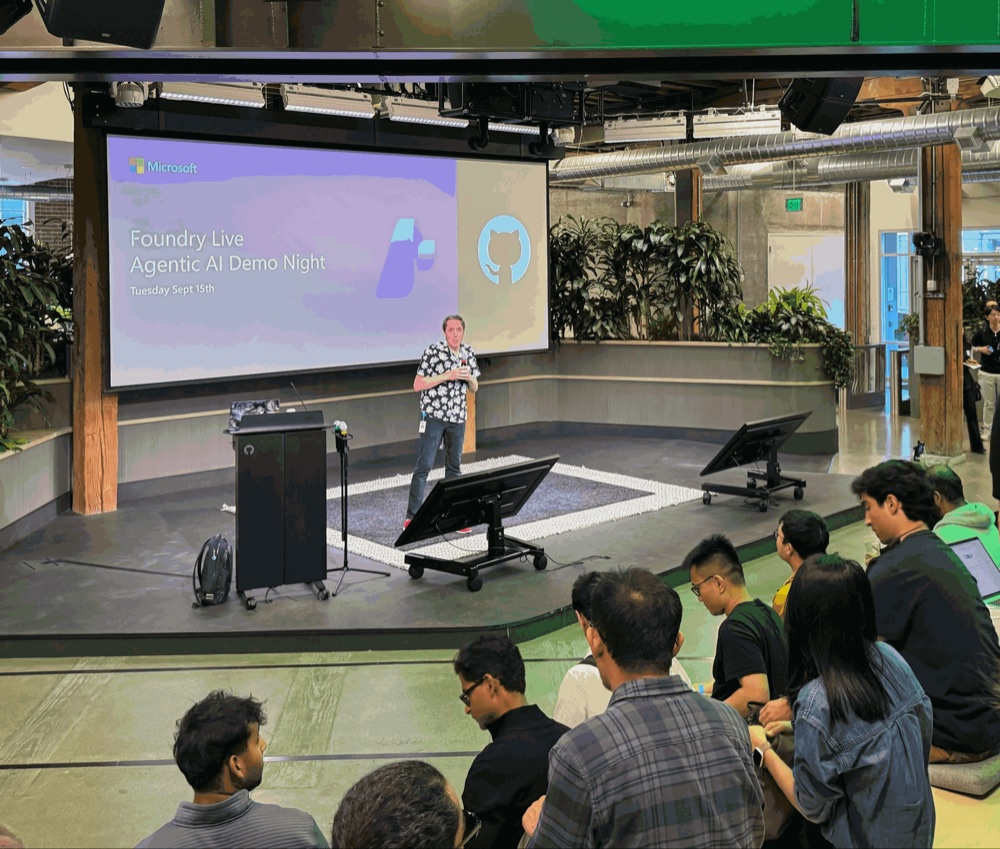 Speaker on stage at Foundry Live Agentic AI Demo Night, hosted by Microsoft and GitHub